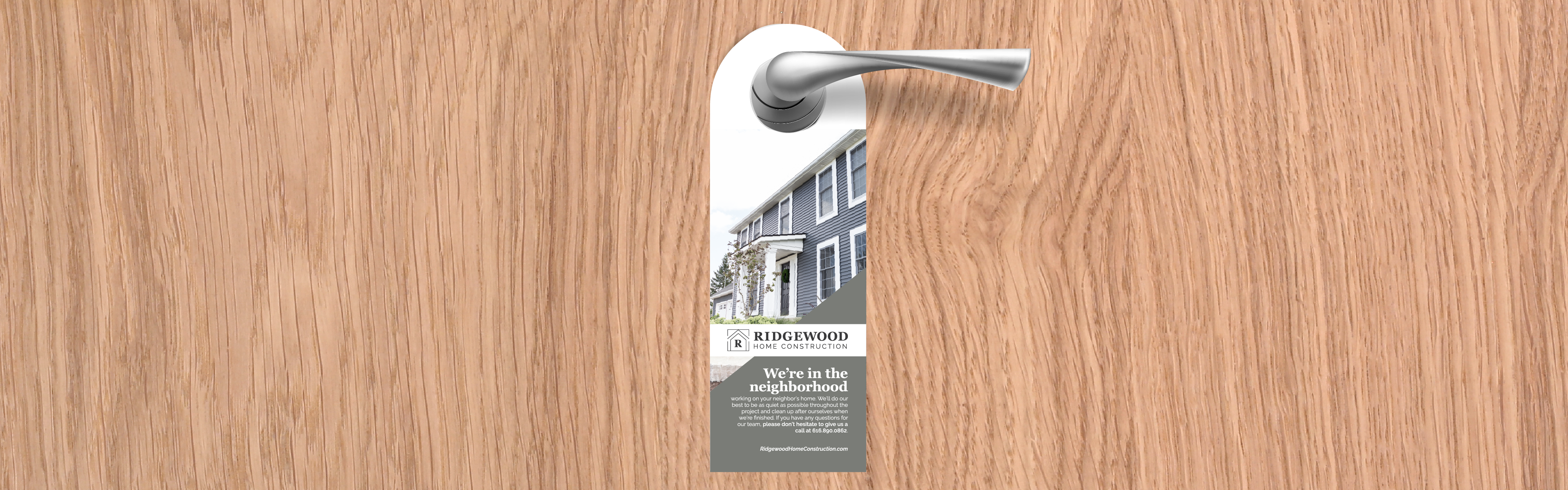 Door hanger advertisement from Ridgewood Home Construction hangs on a wooden door, stating "we're in the neighborhood.