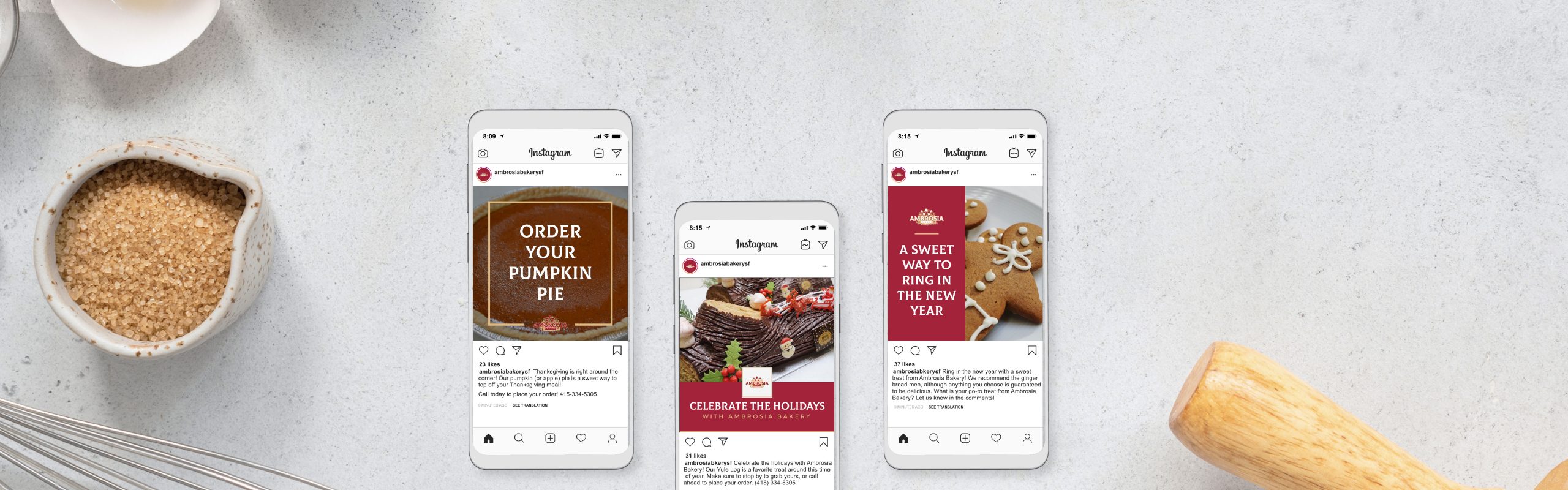 Three smartphones are laid out on a table, each displaying a different Instagram post from Ambrosia Bakery's account promoting various seasonal treats such as pumpkin pie, a festive meat platter, and gingerbread