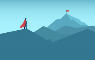 A person in a cape, embodying brand strategy, stands at the foot of a mountain peak looking towards the summit where a flag is planted.