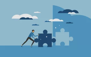 A person pushing a puzzle piece into place to complete a puzzle that forms a bridge across a gap, featured on a blog about brand refresh.