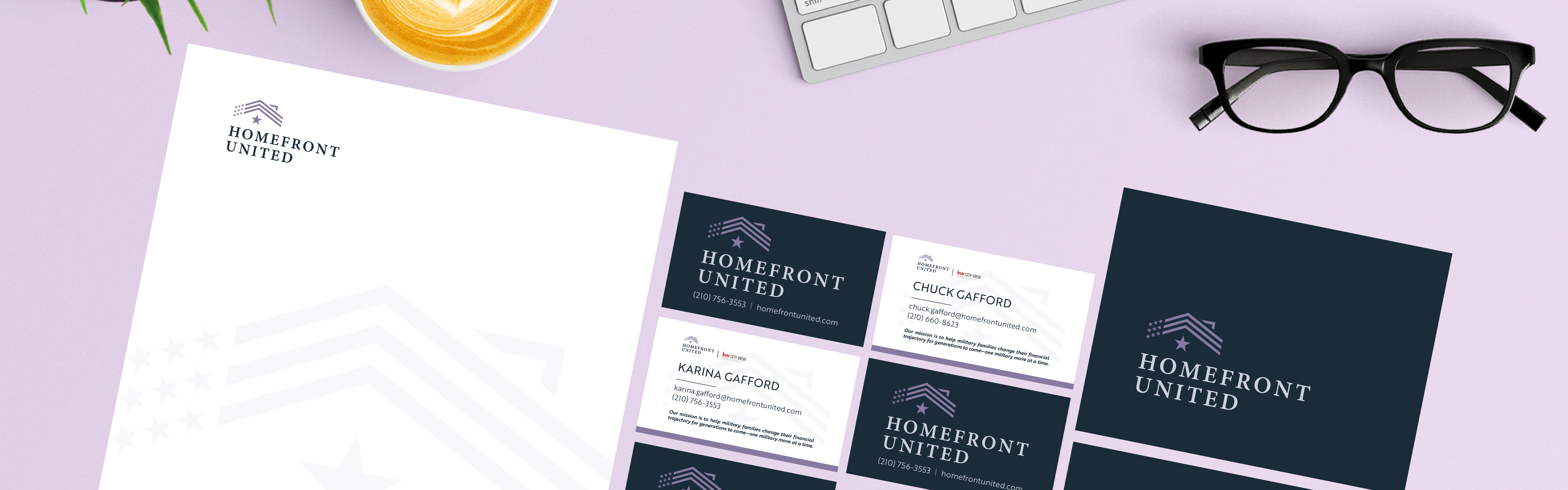 Assorted corporate stationery and branding materials featuring the "homefront united" logo, including letterheads, business cards, and envelopes, displayed on a purple background with a computer keyboard, a cup of.