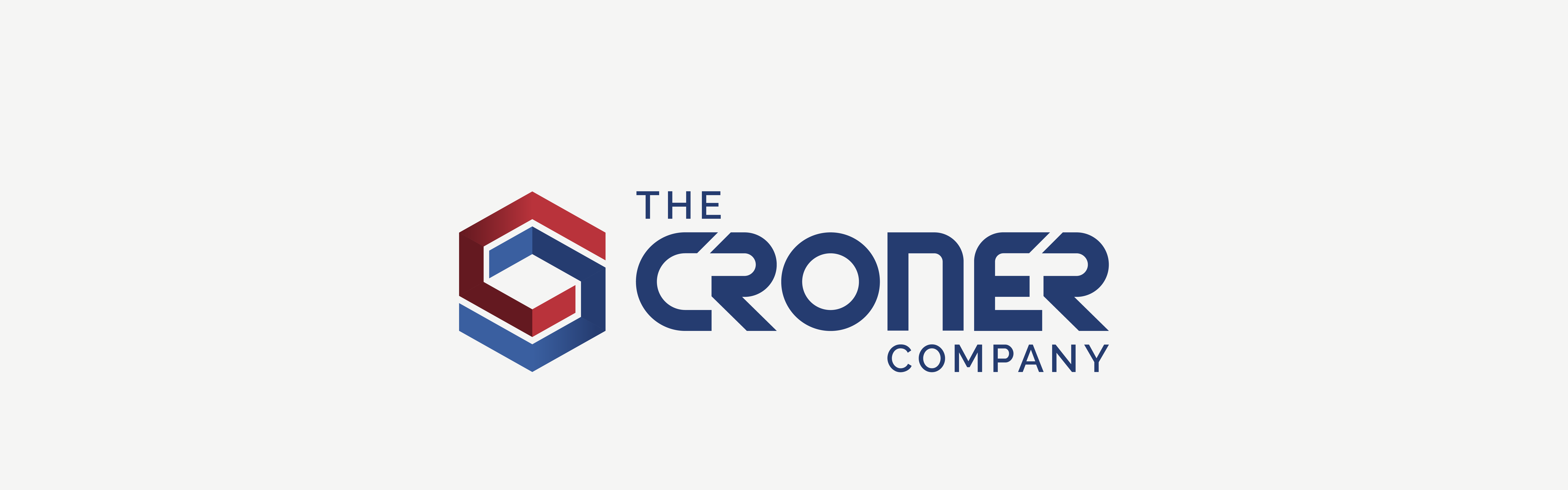 Logo of The Croner Company featuring an emblem with a red and blue hexagon design next to the company name in blue serif font.